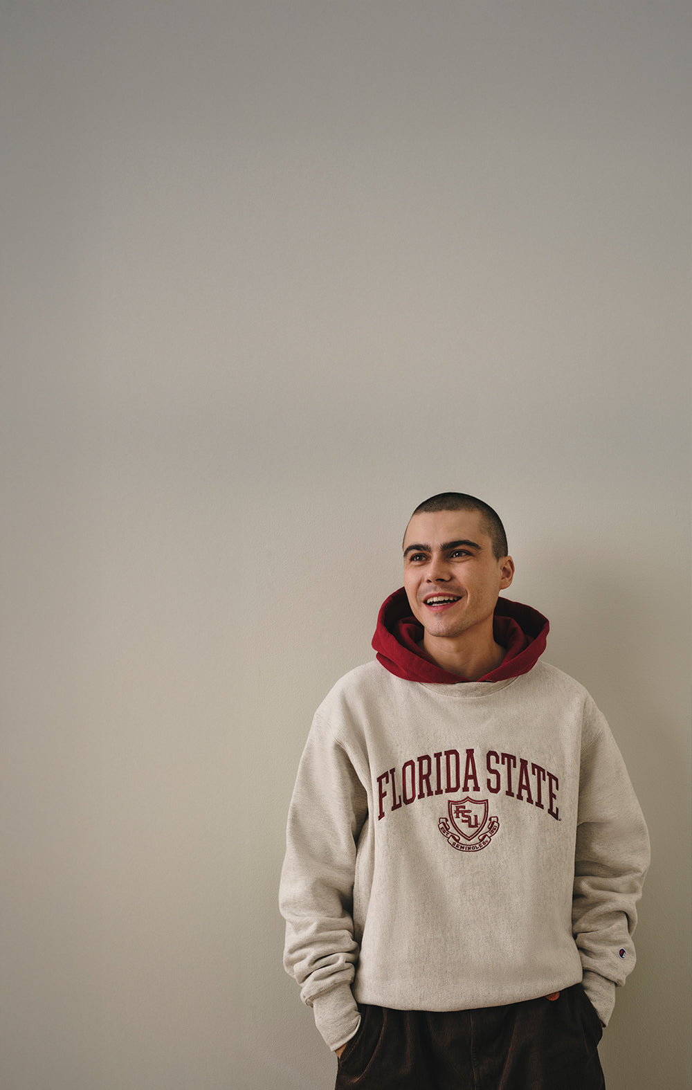 Person wearing a Florida State hoodie against a plain background