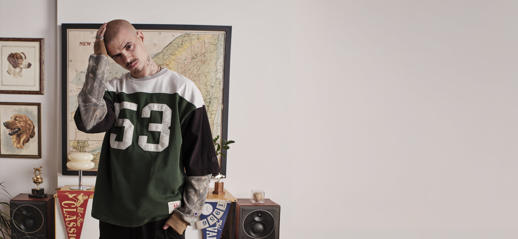 Person wearing a sports jersey with the number 33 in a room with decor elements.