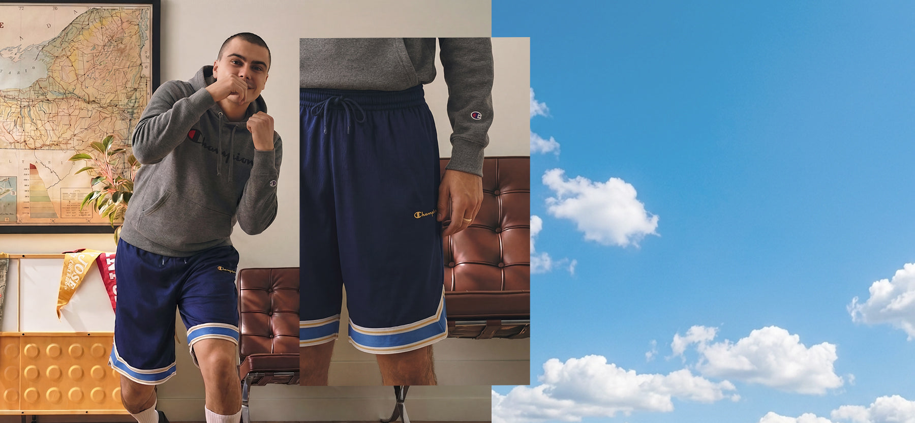 Person wearing blue shorts with a graphic design, standing indoors with a map and plant in the background.