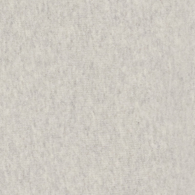 A light gray, textured surface resembling handmade or recycled paper, with subtle speckles and gentle color variations throughout the image, evokes a natural, organic appeal—mirroring the understated elegance of Champion’s Women’s Knitted Half Zip Sweatshirt.