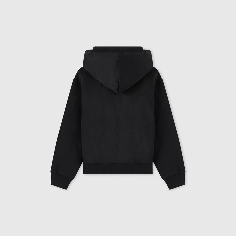 A plain black Women’s Icon Hooded Full Zip Sweatshirt by Champion is shown from the back, with the hood up and sleeves spread outward, against a light gray background.
