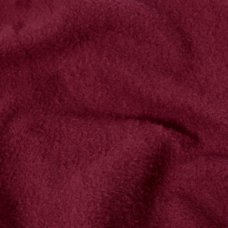 A close-up of the Champion Women’s Knitted Hooded Full Zip Sweatshirt reveals its soft, burgundy-colored knit fabric with a slightly fuzzy texture and gentle folds, evoking the plush comfort of a cozy fleece hoodie.