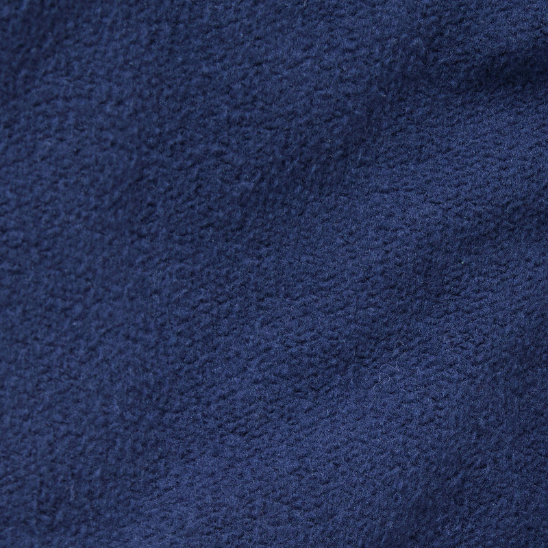 Close-up of dark blue fleece fabric from Champion’s Men’s Knitted Elastic Cuff Pants, highlighting its soft, textured surface and subtle variations in color and weave—an ideal material for comfort and style.