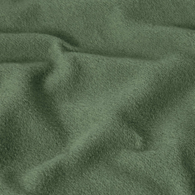 Close-up of green, soft, textured fabric with visible folds and gentle wrinkles, creating a cozy and slightly uneven surface—characteristic of the heavyweight fleece used in the Champion Men’s Relaxed Fit Hooded Sweatshirt.
