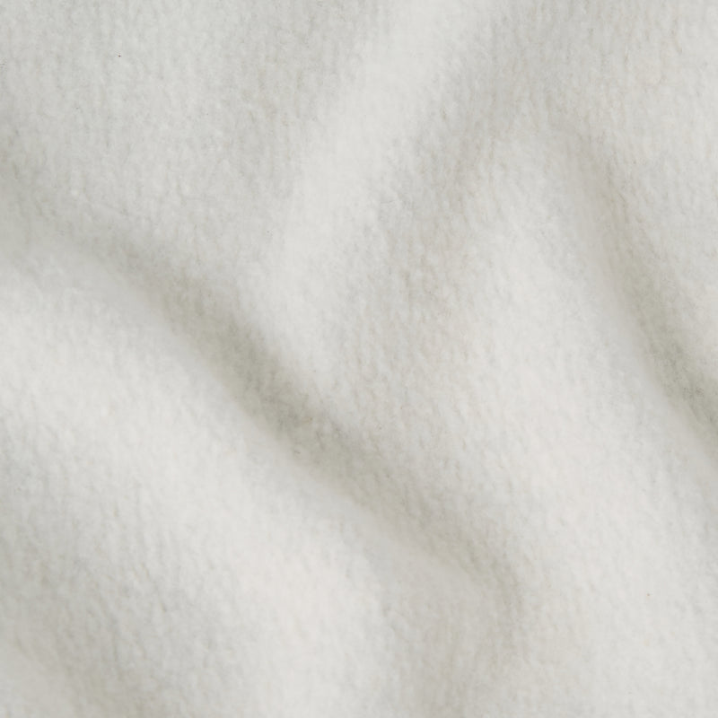 Close-up of a soft, white fleece fabric with subtle folds and a slightly textured surface, reminiscent of the cozy comfort found in Champion Men’s Knitted Elastic Cuff Pants.