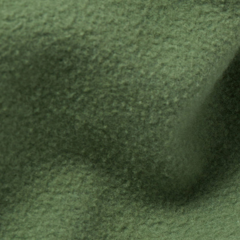 Close-up of textured green fabric with visible fibers and gentle folds, creating soft shadows and a natural, uneven surface—evoking the comfort and style of Champion Men’s Knitted Wide Leg Pants.