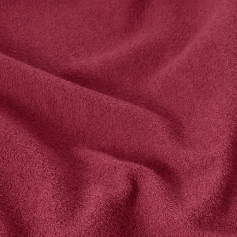 Soft, textured deep red fabric with gentle folds and subtle shadows evokes the cozy, plush feel of a vintage wash—reminiscent of the iconic Champion Men’s Knitted Crewneck Sweatshirt (Reversible + Vintage Wash).