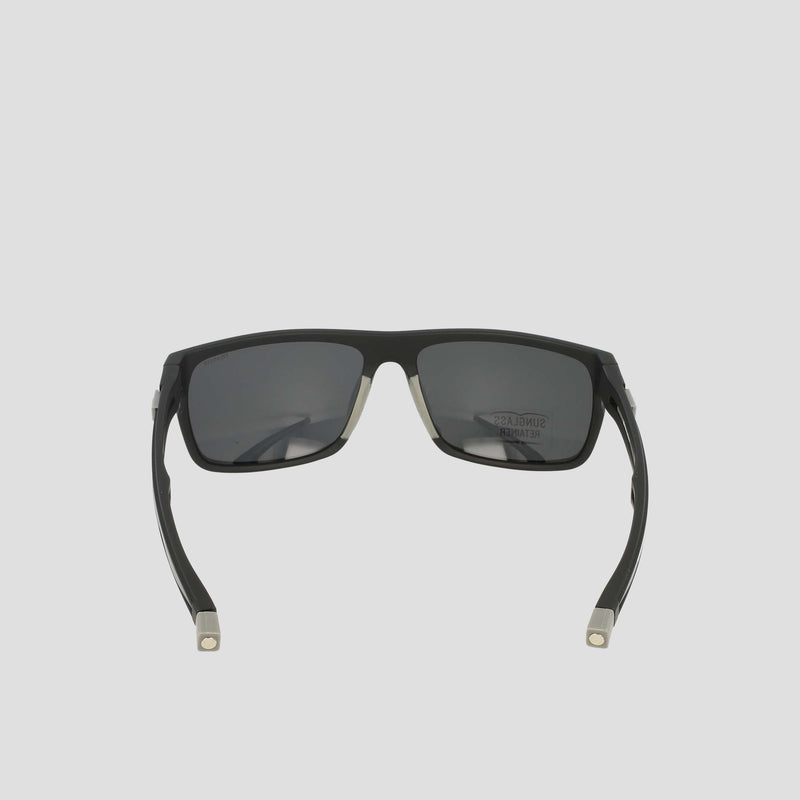 Champion Men's Polarized Wrap - Large sunglasses in black, featuring a sustainable design with a rectangular frame and temple arms, viewed from the back to reveal the inside details, set against a plain light gray background.