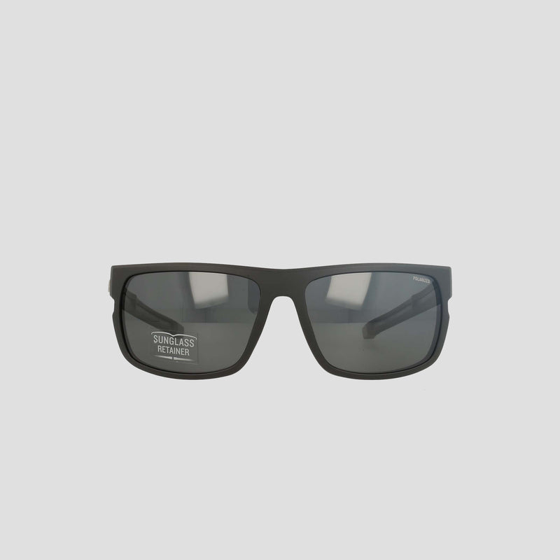 Champion Men's Polarized Wrap - Large sunglasses displayed facing forward against a plain light background. These black rectangular frames feature sustainable design and dark polarized lenses, with a small sticker on the left lens that reads "Sunglass Retainer," offering both style and function in a men's retainer frame.