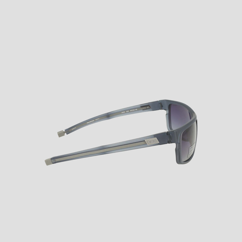 Champion Men's Polarized Wrap - Large sunglasses in gray feature a sustainable, bio-based rectangular frame with a distinctive silver accent on the left temple. Displayed from the side against a plain white background, these sunglasses offer polarized lenses with a subtle purple tint for enhanced style and functionality.