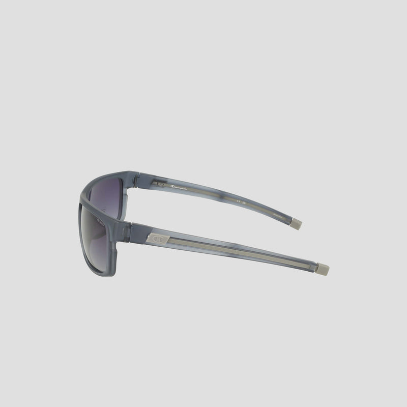 Champion Men's Polarized Wrap - Large sunglasses in gray, featuring rectangular bio-based frames with dark polarized lenses, viewed from the side and showcasing metallic accents near the hinges, set against a plain light background.