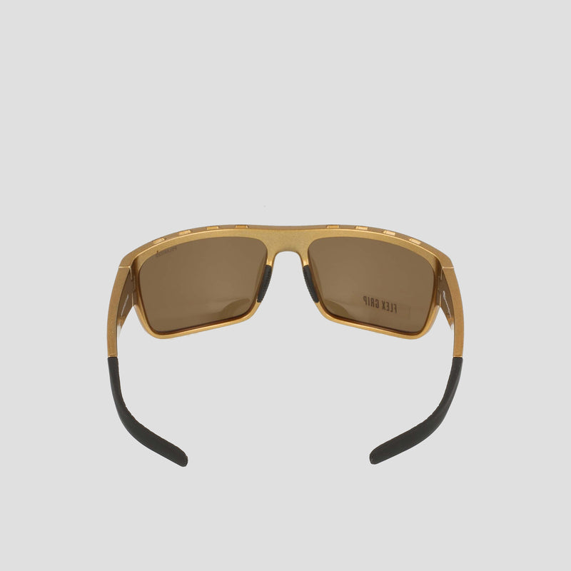 Champion Men’s Polarized Grilamid Flex Grip Tip - Large sunglasses feature a gold frame, brown polarized lenses, and black-tipped arms. Shown from the front against a plain light gray background, these shades are designed for lightweight comfort—combining clarity and style wherever you go.