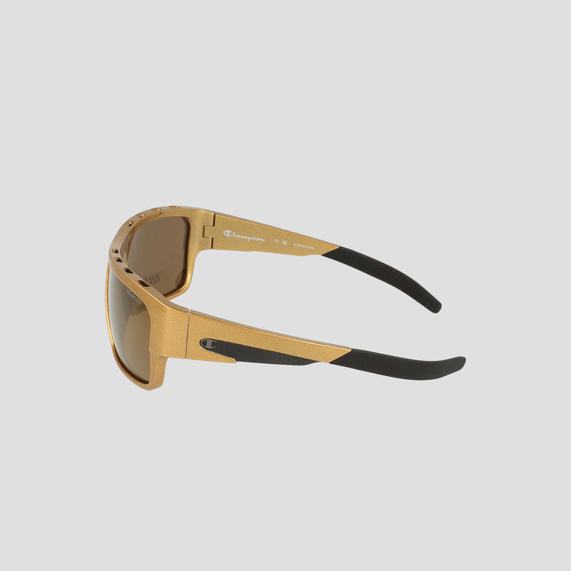 The Champion Men's Polarized Grilamid Flex Grip Tip - Large sunglasses are displayed from a side angle on a light gray background. Featuring tinted, polarized lenses for enhanced clarity, these RX-able frames offer lightweight comfort and are finished with a small Champion logo on the temple.