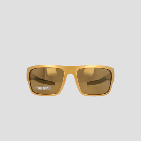 Champion Men's Polarized Grilamid Flex Grip Tip - Large sunglasses in yellow rectangular frames, featuring brown tinted polarized lenses. "FLEX GRIP" is printed in white on the lower corner of the left lens. Designed by Champion for lightweight comfort, these sunglasses also have an RX-able frame for added versatility, and are shown against a plain light grey background.