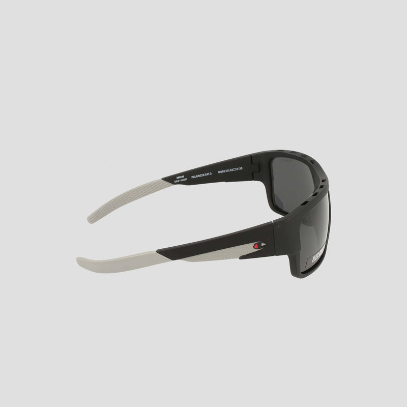 Champion Men's Polarized Grilamid Flex Grip Tip - Large sunglasses feature a sporty black and white design with dark polarized lenses. A small red and white Champion logo accents the arm, while the inside of the arm is finished in white and includes detailed model and lens information. Crafted for ultra-lightweight comfort, these sunglasses are ideal for all-day wear.