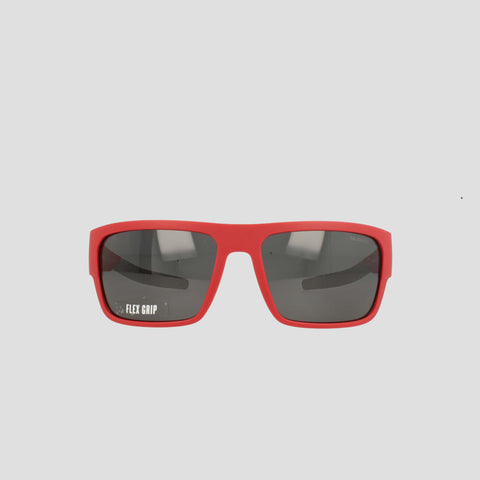 Champion Men's Polarized Grilamid Flex Grip Tip - Large sunglasses are displayed facing forward on a white background. These red rectangular sunglasses feature dark polarized lenses, with "FLEX GRIP" printed in white on the left lens. Designed by Champion for lightweight comfort, they're perfect for all-day wear.