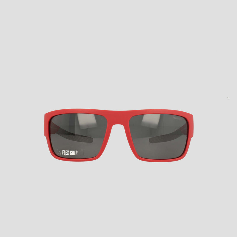 Champion Men's Polarized Grilamid Flex Grip Tip - Large sunglasses are displayed facing forward on a white background. These red rectangular sunglasses feature dark polarized lenses, with "FLEX GRIP" printed in white on the left lens. Designed by Champion for lightweight comfort, they're perfect for all-day wear.