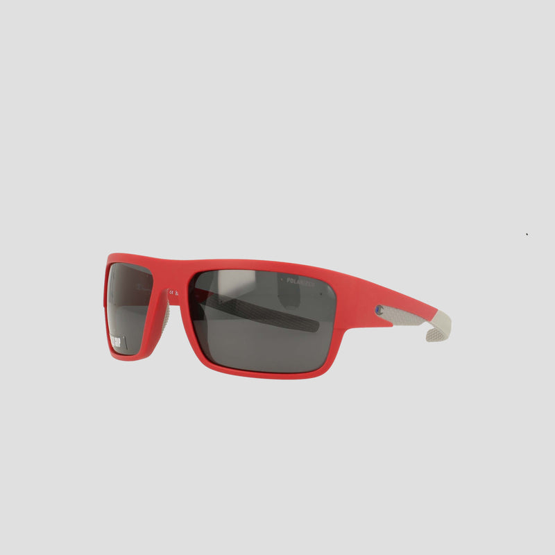 Champion Men's Polarized Grilamid Flex Grip Tip - Large sunglasses, featuring a red rectangular frame with black polarized lenses and gray textured tips on the arms, are displayed against a plain white background.