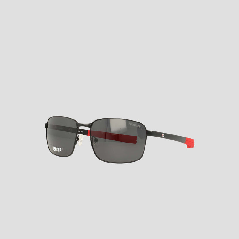 Men’s Champion Polarized Stainless ST-Shirtl Flex Grip Tip sunglasses feature a sleek rectangular black frame with thin black and red arms, a "Polarized" label on one lens, and are designed for active lifestyles. The retainer frame stands out against a plain light gray background.