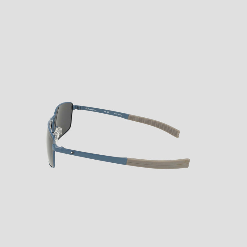 Experience the Champion Men’s Polarized Stainless ST-Shirtl Flex Grip Tip sunglasses—showcased from a side angle against a plain light background. This pair features a sleek blue frame with brown flex grip tips and polarized lenses for enhanced clarity, making them perfect for active lifestyles.