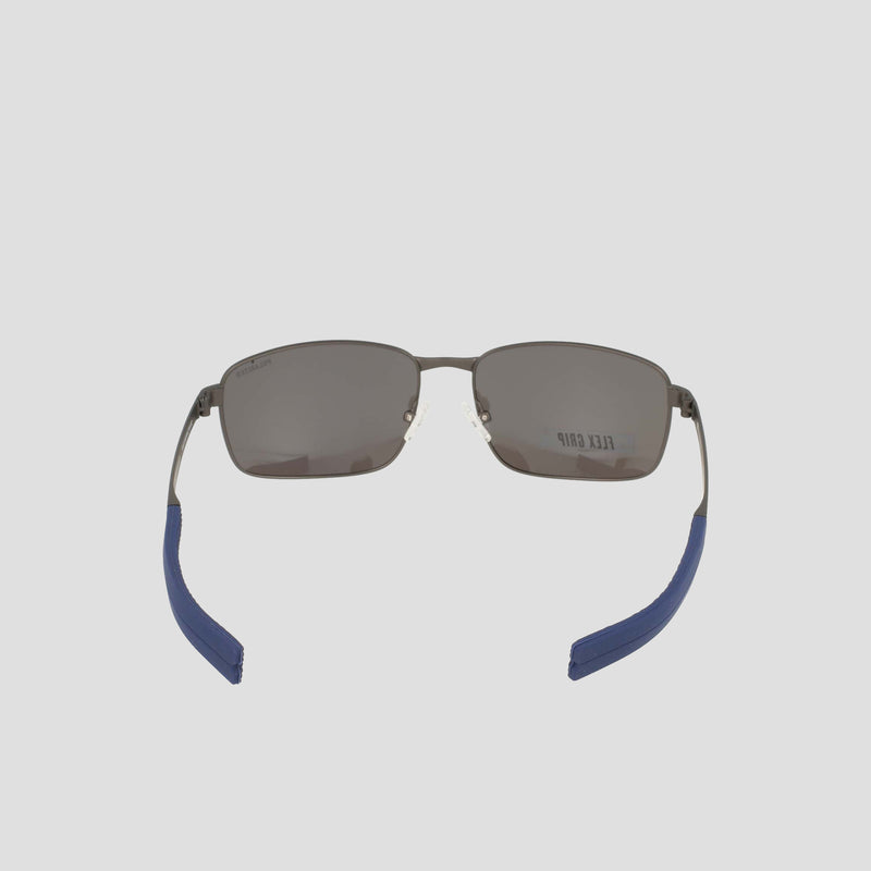 Men’s Polarized Stainless ST-Shirtl Flex Grip Tip sunglasses by Champion, featuring a rectangular design with dark polarized lenses, silver metal frames, and blue grip ear tips. Shown from the back to highlight the inside of the arms and a partial Champion logo on the right lens—an ideal choice for active lifestyles.