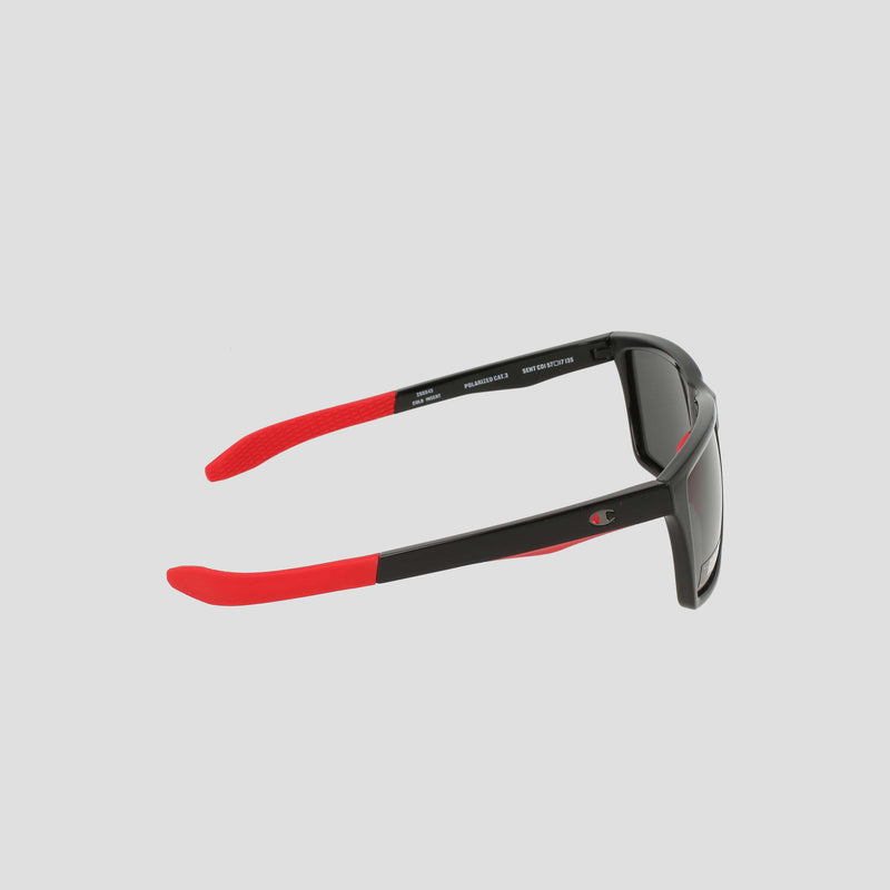 Champion Men's Polarized Grilamid Flex Grip Tip sunglasses in medium, shown from the side on a plain white background. The arms are predominantly black with bright red tips and interior, crafted from lightweight TR90 Grilamid for added comfort, and feature dark polarized lenses facing right.