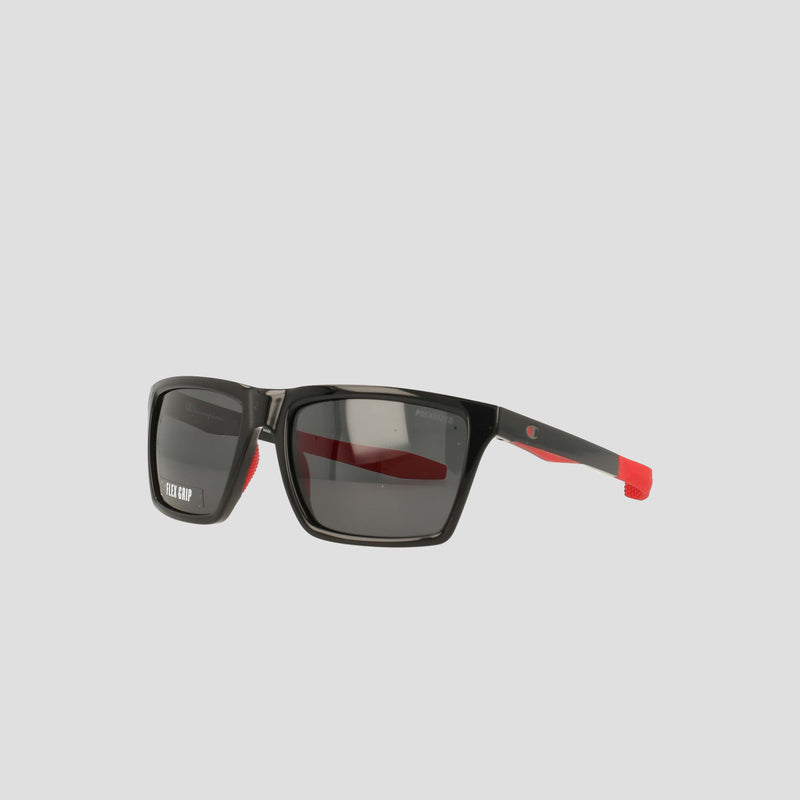Champion Men's Polarized Grilamid Flex Grip Tip - Medium rectangular sunglasses with polarized dark lenses, red accents on the arms, and a lightweight TR90 RX-able frame, displayed against a plain light gray background.