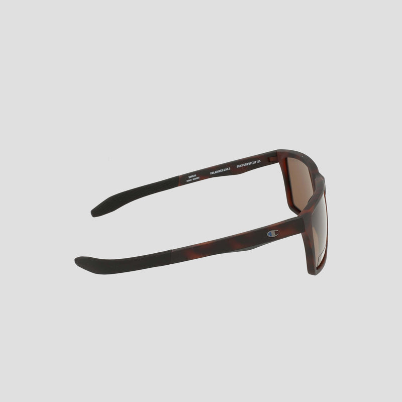 Men's Polarized Grilamid Flex Grip Tip sunglasses by Champion, featuring a brown tortoiseshell frame with black rubberized arms. Shown from a side angle on a light gray background, these lightweight TR90 RX-able sunglasses are finished with the Champion logo on the temple.