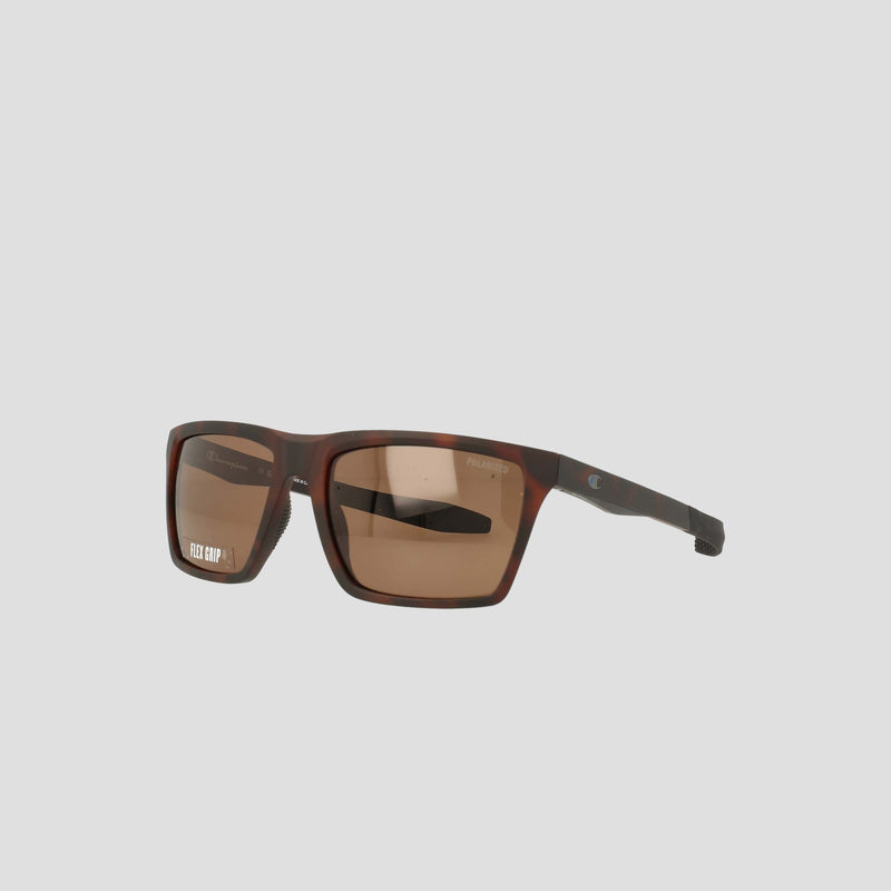 Champion Men's Polarized Grilamid Flex Grip Tip sunglasses in a brown rectangular design, featuring polarized lenses, a subtle temple logo, and a lightweight TR90 frame, displayed against a light grey background.