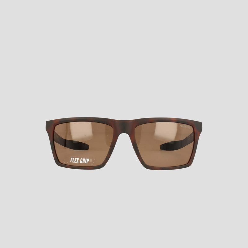 Champion Men's Polarized Grilamid Flex Grip Tip sunglasses in a medium size, featuring a brown rectangular RX-able frame and slightly tinted lenses. Displayed on a plain light gray background, the left lens displays the words "FLEX GRIP" in white text.