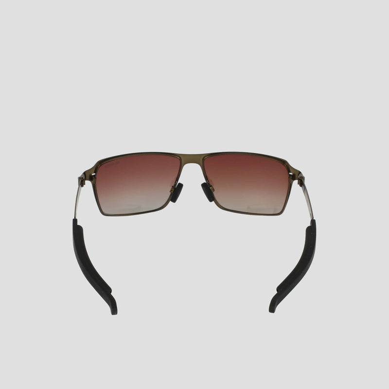 The Champion Men's Polarized Stainless ST-Shirtl Comfort Fit features square sunglasses with a gold stainless steel frame, red gradient lenses, and black curved earpieces with adjustable rubber tips, shown on a plain light gray background.