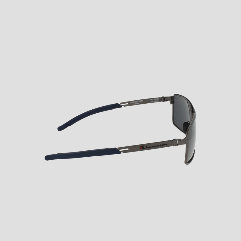 Side view of Men’s Polarized Stainless ST-Shirtl Comfort Fit sunglasses by Champion, featuring blue adjustable rubber tips and logo on a lightweight stainless steel frame, set against a plain light background.