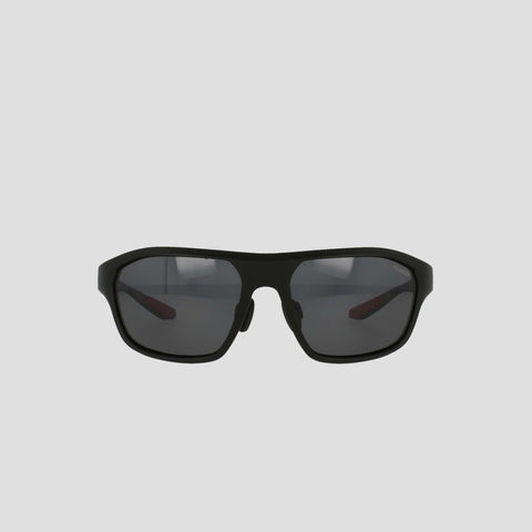 Champion Men's Polarized Comfort Fit - Large sports sunglasses, featuring a black, slightly curved TR90 frame with polarized lenses. The design includes adjustable rubber tips for enhanced comfort and a secure fit, displayed against a plain, light gray background.