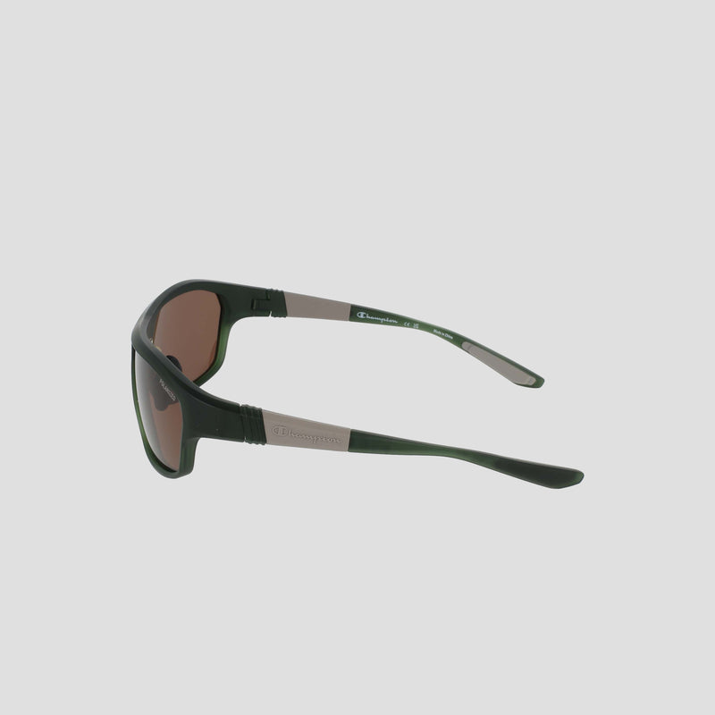 Side view of a pair of Champion Men's Polarized Comfort Fit - Large sunglasses in black and brown, with curved arms set against a plain light gray background. The TR90 frame showcases a small rectangular logo detail on the side, while adjustable rubber tips provide a secure and comfortable fit.