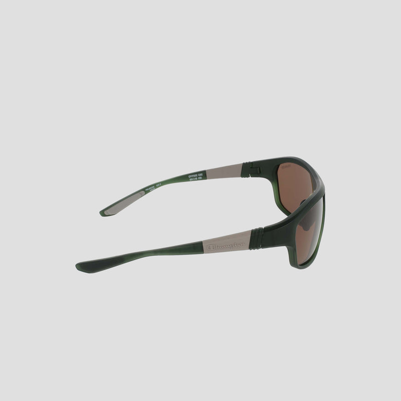 Side view of Champion Men's Polarized Comfort Fit - Large sunglasses in green and black, featuring brown-tinted polarized lenses and a lightweight TR90 frame, highlighting the left temple and hinge against a plain light background.