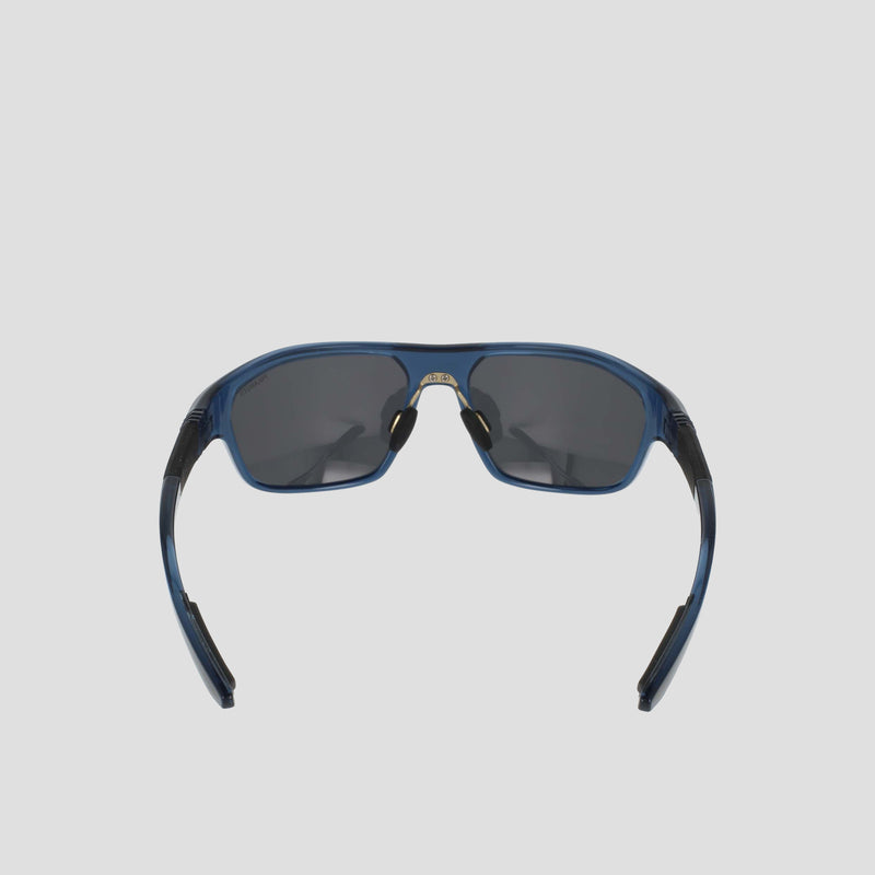 A pair of Champion Men's Polarized Comfort Fit - Large sports sunglasses are shown from the front against a light gray background. The blue TR90 frame offers lightweight durability, while the arms are slightly open and feature black detailing. The dark polarized lenses complete the look.