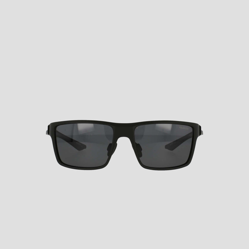 A pair of Champion Men's Polarized Comfort Fit - Medium sunglasses featuring a black rectangular design with dark lenses and a lightweight frame, displayed against a plain light gray background.