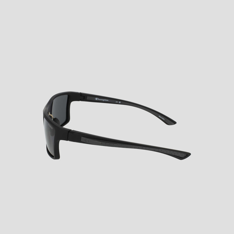 Men's Polarized Comfort Fit - Medium by Champion, featuring black wraparound frames with thick arms and a lightweight design, displayed from a rear side angle against a plain light gray background.