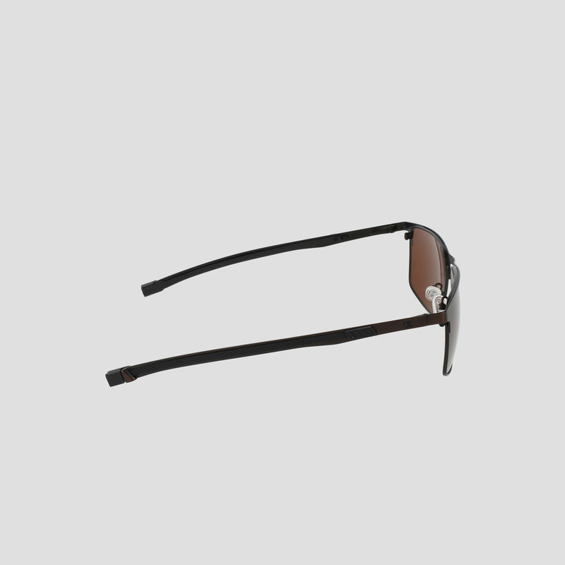 Men's Polarized Retainer Stainless ST-Shirtl Square sunglasses by Champion, featuring brown lenses and a thin black stainless steel frame, are displayed from the side on a plain light gray background. The arms of the sunglasses are slightly open and angled upwards.
