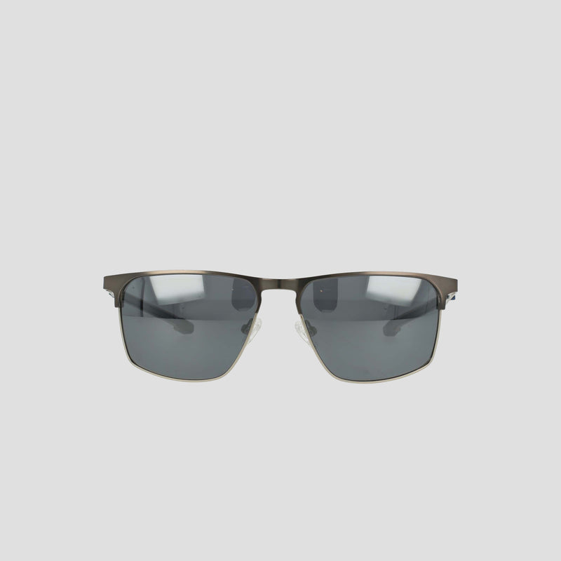Champion Men's Polarized Retainer ST-Shirtl Square sunglasses feature a rectangular stainless steel frame with dark polarized lenses and adjustable nose pads, showcased against a plain light gray background.