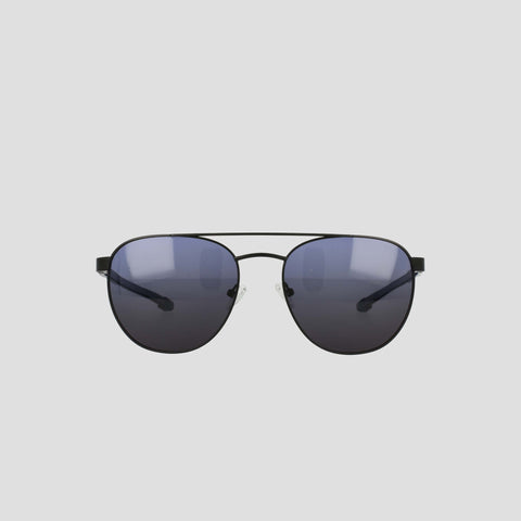 Men's Polarized Retainer Stainless ST-Shirtl Aviator sunglasses by Champion, featuring dark polarized lenses and an adjustable nose bridge, are displayed facing forward on a plain light gray background.