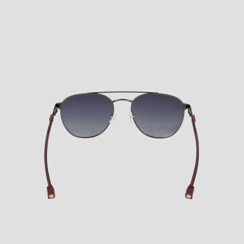 A pair of Champion Men's Polarized Retainer Stainless ST-Shirtl Aviator sunglasses, featuring dark gradient polarized lenses, thin lightweight stainless steel frames, and maroon temple tips, shown on a plain light gray background.