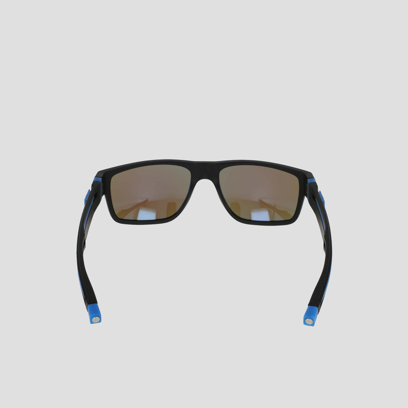 Champion Men's Polarized Retainer Rectangle sunglasses feature black, high-performance retainer frames with blue accents on the arms and mirrored brown polarized lenses, crafted from durable TR90 construction and showcased against a light gray background.