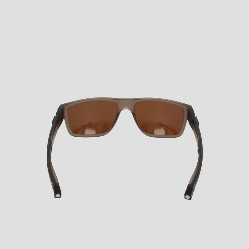 A pair of Champion Men's Polarized Retainer Rectangle sunglasses featuring brown-tinted polarized lenses and dark semi-transparent frames made from high-performance TR90 material, displayed front-facing against a light gray background.