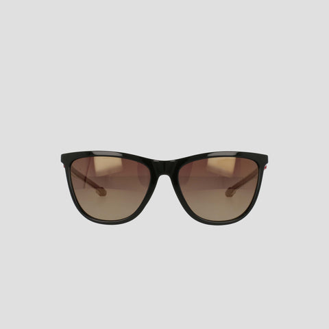 A pair of Champion Women's Polarized Retainer Rectangle sunglasses, featuring black frames and brown gradient lenses, is displayed against a plain light gray background, bringing a chic update to classic athleisure eyewear.
