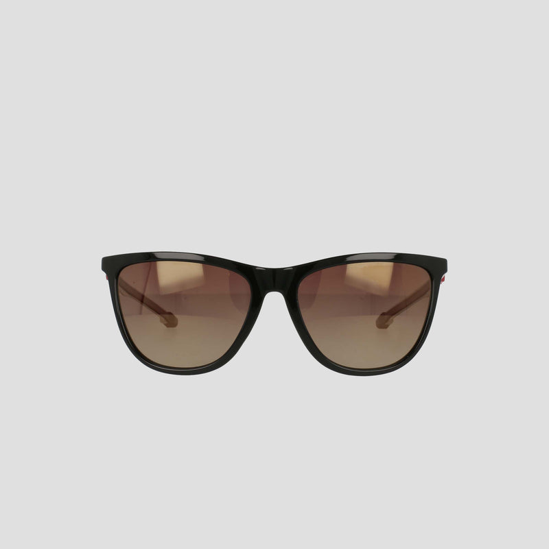 A pair of Champion Women's Polarized Retainer Rectangle sunglasses, featuring black frames and brown gradient lenses, is displayed against a plain light gray background, bringing a chic update to classic athleisure eyewear.