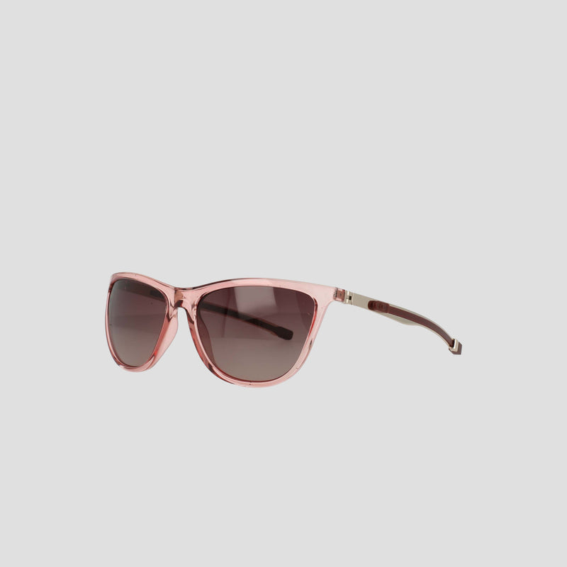 Women's Polarized Retainer Rectangle sunglasses by Champion featuring pink translucent frames with large, rounded, gradient-tinted lenses. Displayed on a plain light gray background, these athleisure eyewear pieces blend style and comfort effortlessly with their slightly rectangular shape and thin arms.