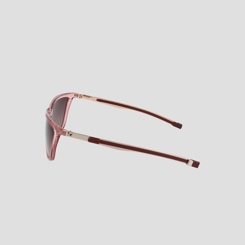 Side view of the Champion Women's Polarized Retainer Rectangle sunglasses featuring a pink cateye frame, gold and maroon arms, dark polarized lenses, and a minimalistic modern design, set against a plain light background.