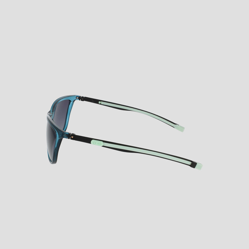 Side view of the Champion Women's Polarized Retainer Rectangle sunglasses in blue, showcasing black and light green arms, rectangular polarized lenses, and stylish light green accents at the hinges and temple tips—all set against a plain light background, making them an ideal choice for athleisure eyewear enthusiasts.