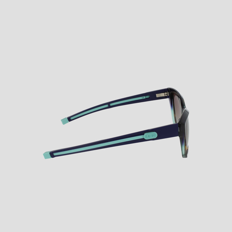 Side view of Champion Women's Polarized Retainer Square sunglasses, featuring dark handmade acetate frames, polarized lenses, and light blue accents on the arms and tips, set against a plain light background.
